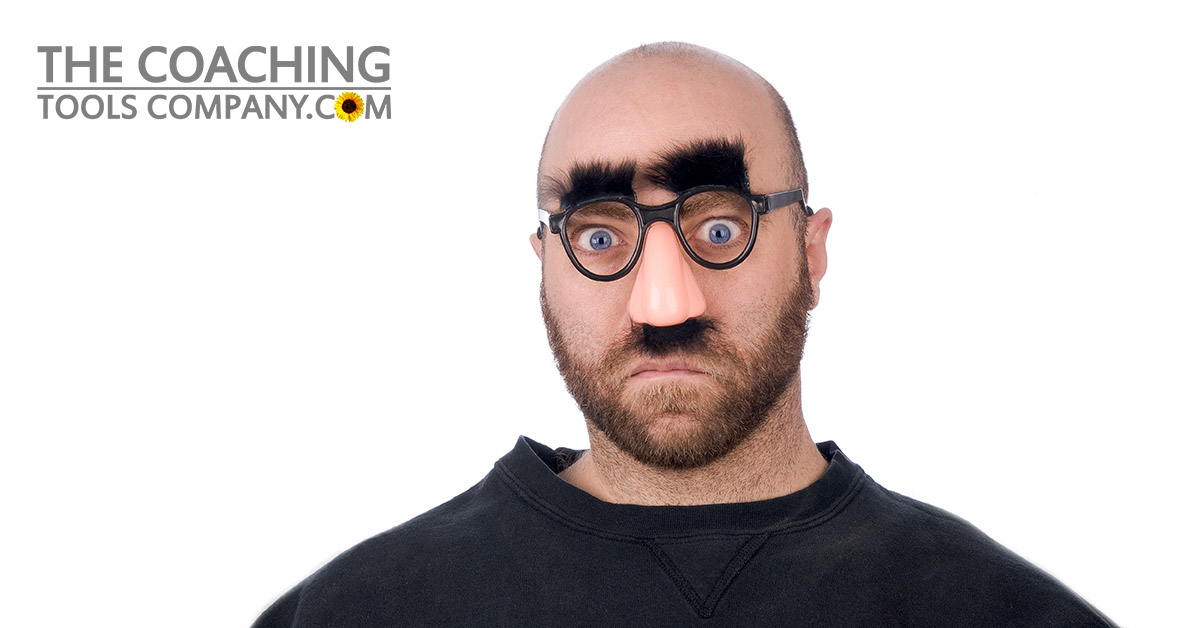 Man wearing fake glasses nose and eyebrows
