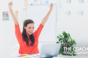 Happy Coach with Life Coaching Activities & Tools with a Laptop