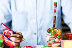 Man with Messy Hands Trying to Work