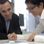 business coaching exercise, templates & forms - woman coaching man filling worksheets