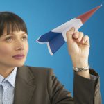 goal-setting templates and worksheets image - woman imagining with paper aeroplane