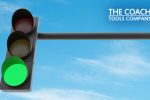 Green Traffic light against blue sky