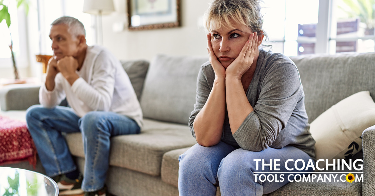 Couple arguing on sofa feeling disconnected