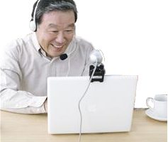 How to record coaching sessions shown by man with headset using a laptop