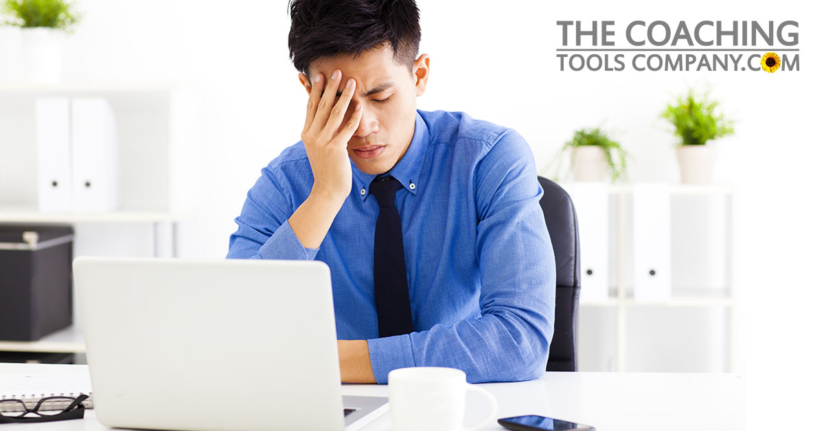 Stressed out Client in the Office with laptop and phone