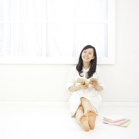 Woman Journaling for Success on Desk