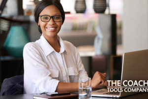 Happy Client or Coach Managing their Task List at Desk