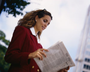 Businesswoman Reading a Newspaper