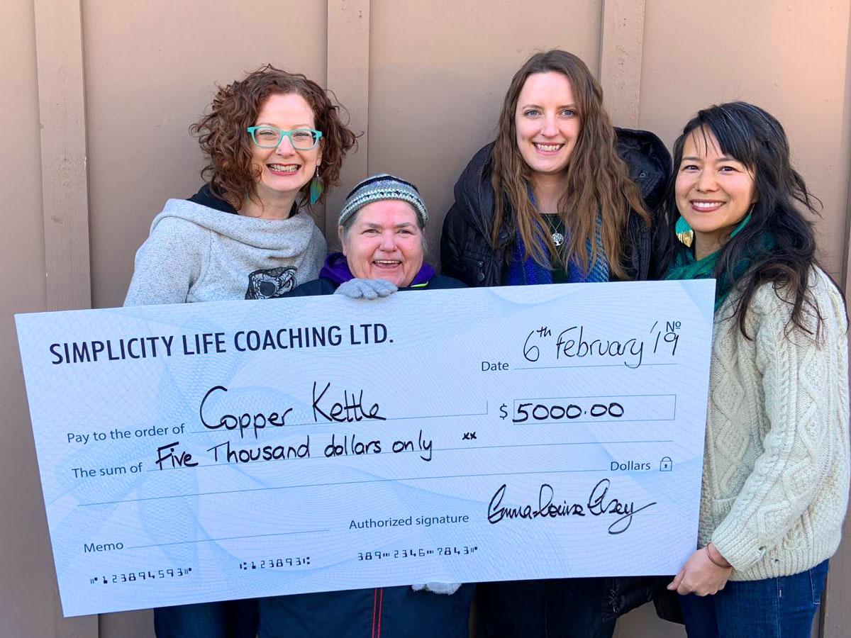 Cherie Gouvreau holding Giant Cheque with TCTC Employees