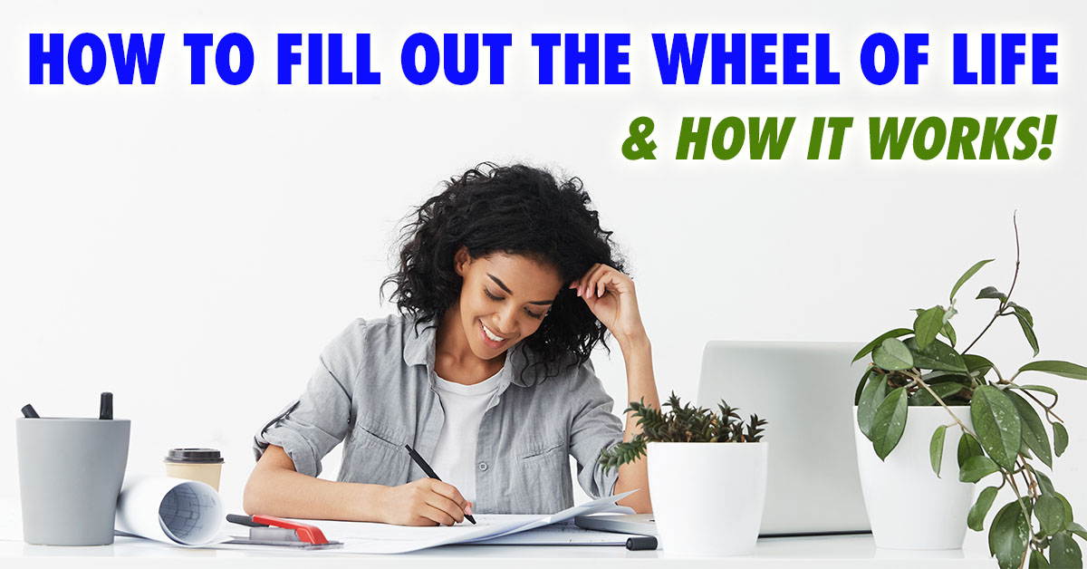Client at desk completing a Wheel of Life Exercise