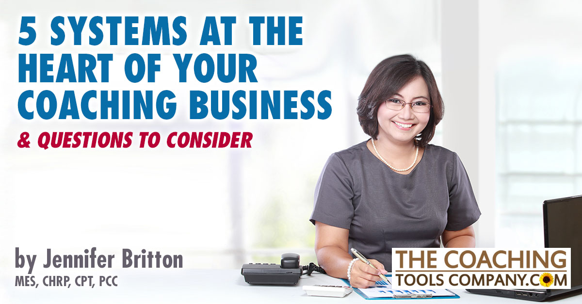 Coach sitting at desk using their business systems