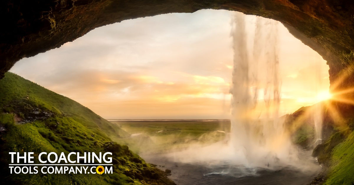 Looking out of cave in iceland - showing awe & wonder in coaching