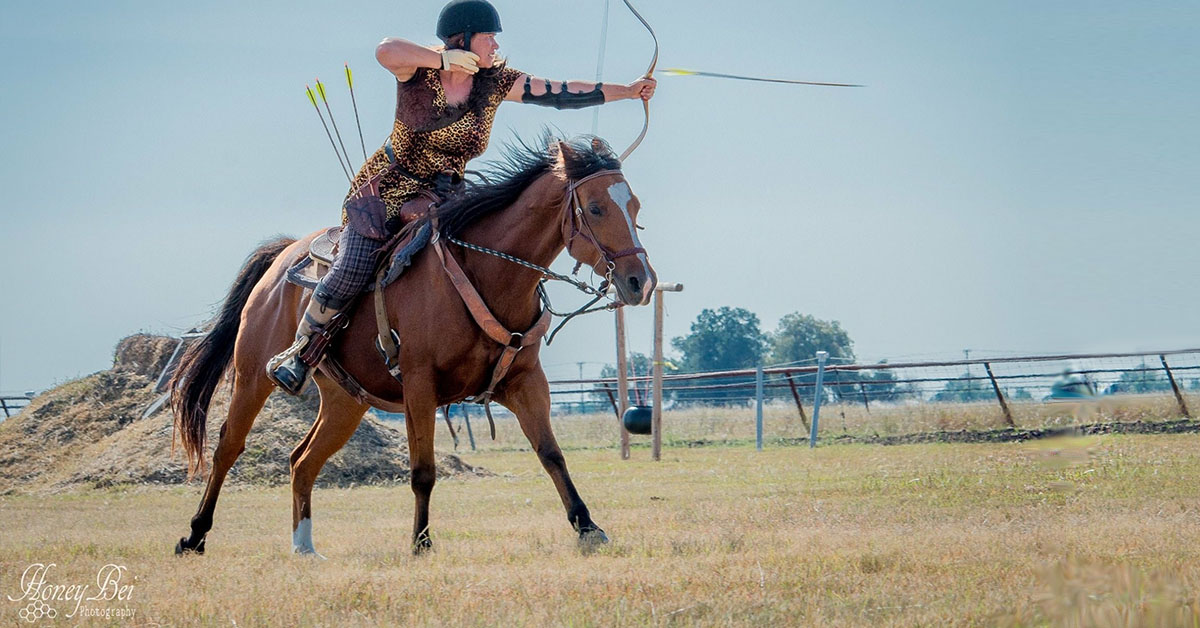Bianca Stawiarski Horse Archery Coach on Horseback firing arrow