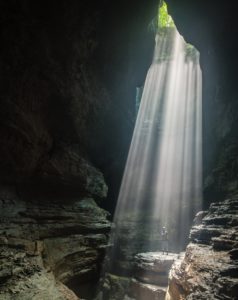 Person in cave looking out at the light -from Burst