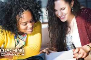 4 Types of Journaling shown by coach with client and journal