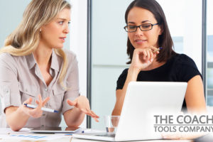 Client and Coach looking at laptop