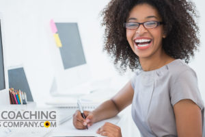Happy Client Using Goal Setting Tips at Desk