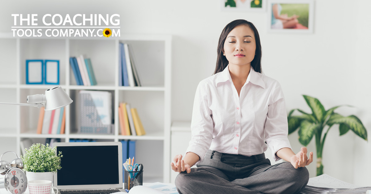Client or Coach building motivation by sitting on desk meditating