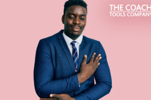 Businessman in blue suit giving himself some self-kindness with his hand on heart