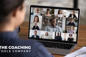 Coach attending an online session on a laptop, focused and engaged in a virtual learning environment.